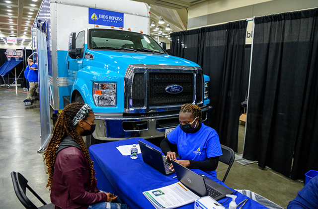 A CIAA Fan Fest attendee answers screening questions.