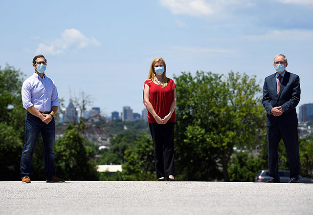 Panagis Galiatsatos, Kimberly Monson and Dan Hale standing outside