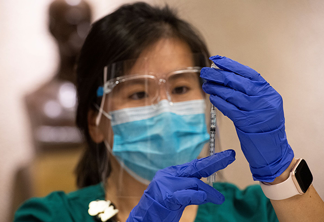 Denise Fu holding syringe