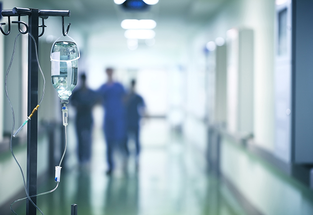 Doctors walking in a hospital hallway.