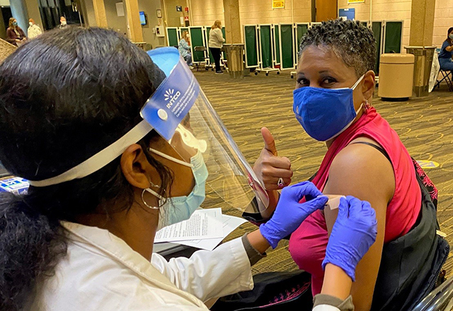 Dr. Sherita Golden receiving her COVID-19 vaccination at the Johns Hopkins Hospital.