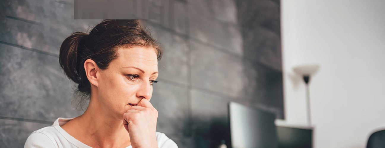 A woman looks worried.