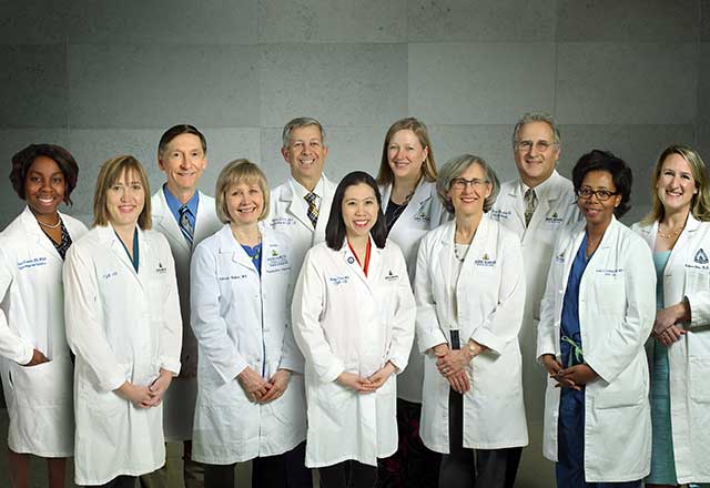 Group shot of Gyn Ob Clinical Directors in white coats