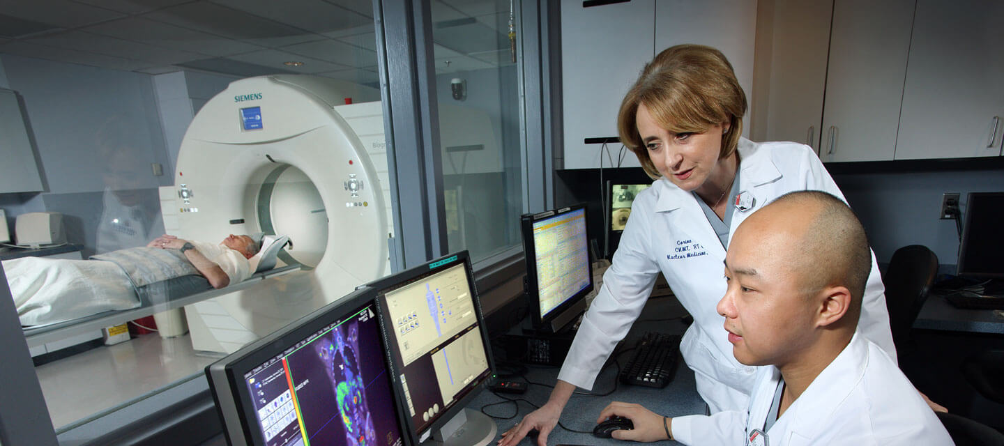 Radiology student works with professor.