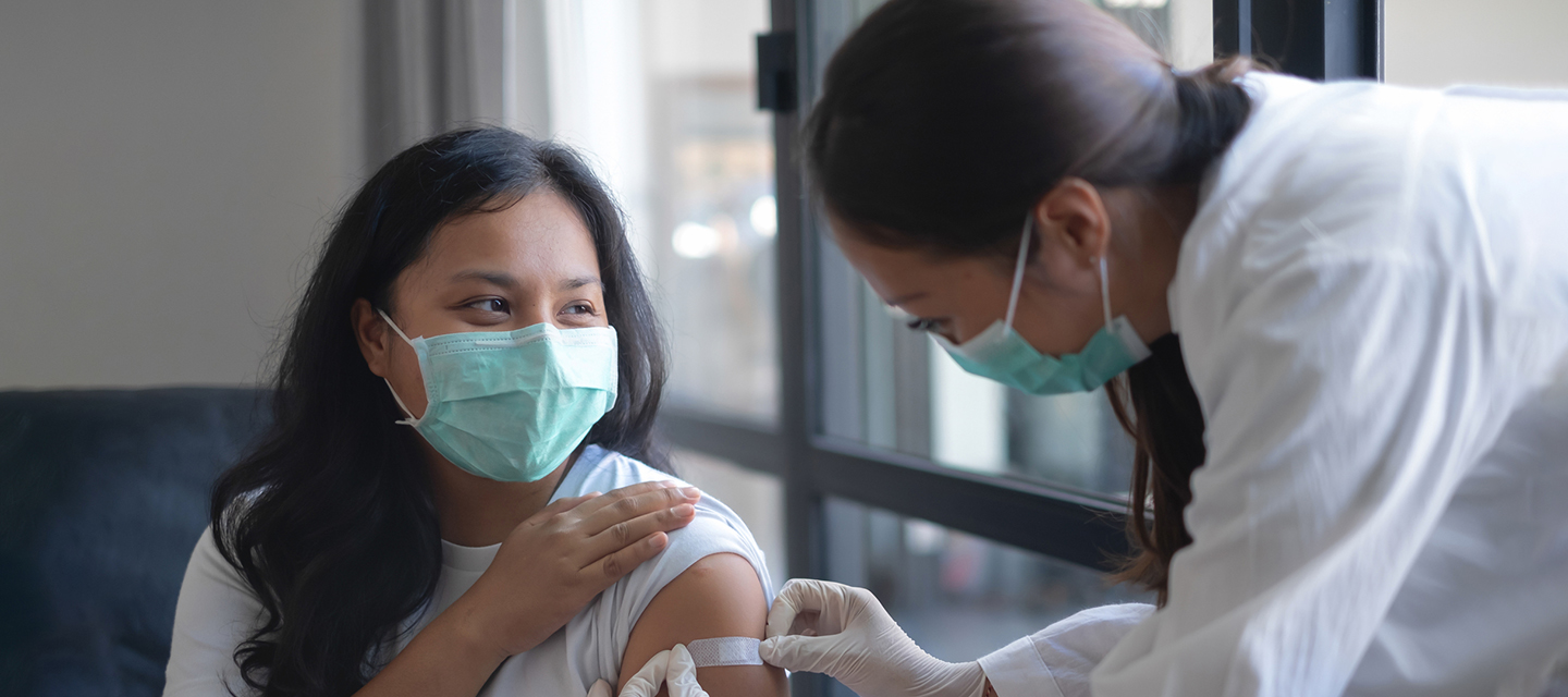 Clinician talking to a patient. 