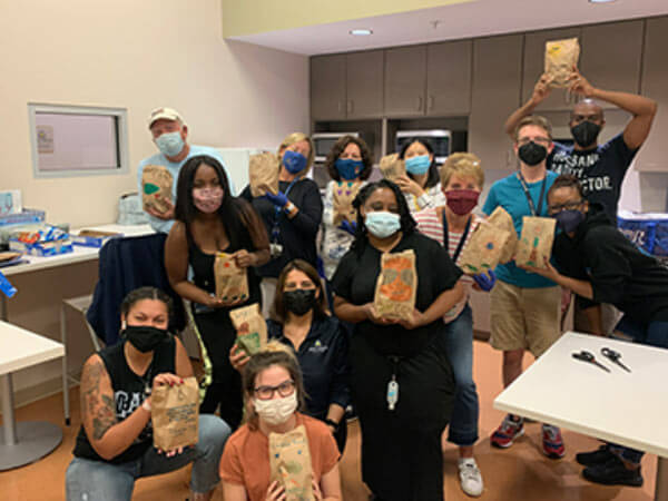 Home Care Group volunteers create lunches for Bunches of Lunches