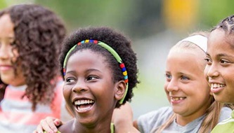 A group of young girls hang out together.