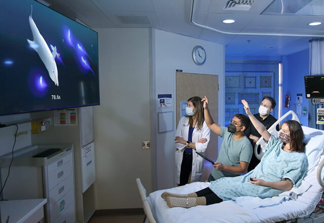 a patient playing a video game to improve motor skills