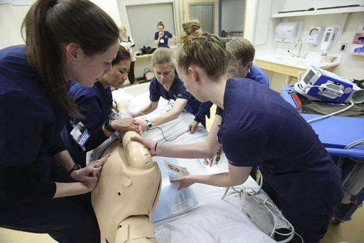 Nurses working on dummy