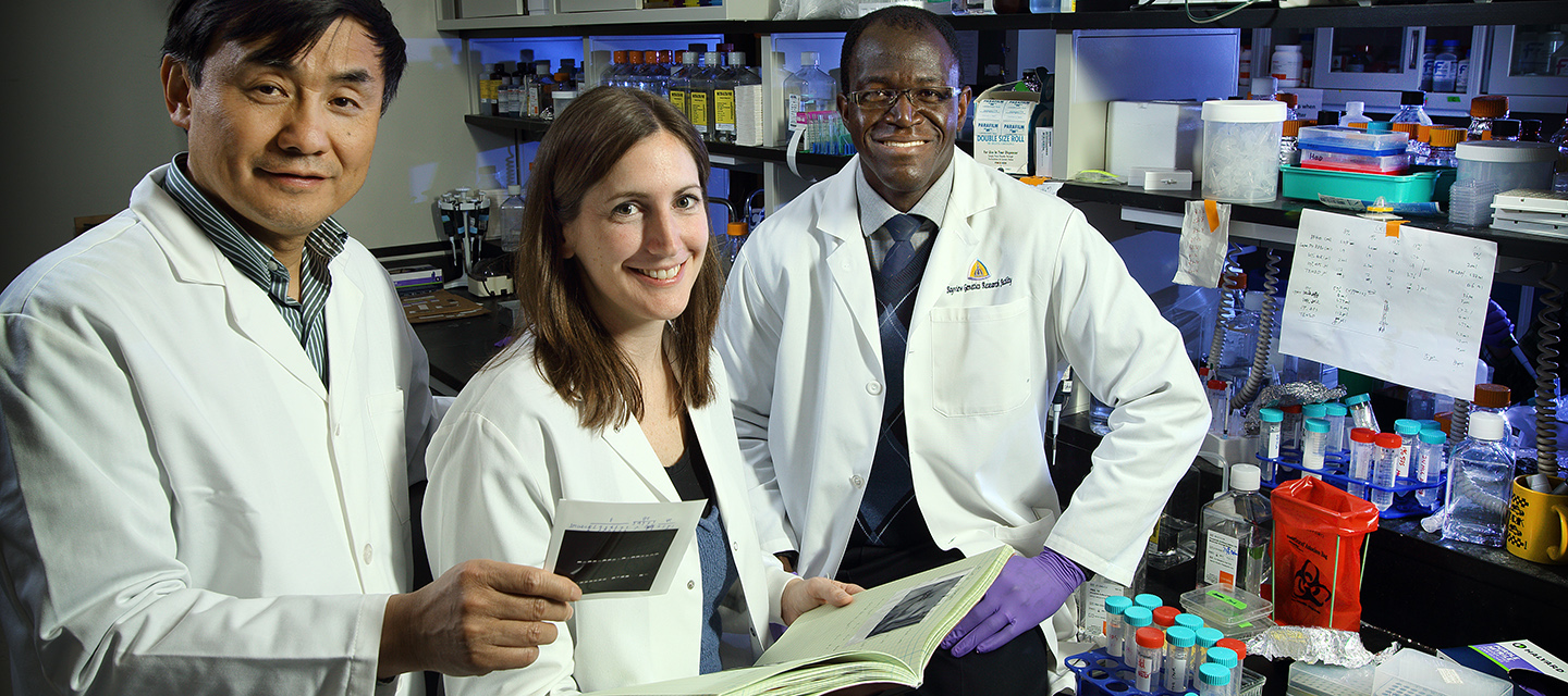 Genetics research faculty in the lab.