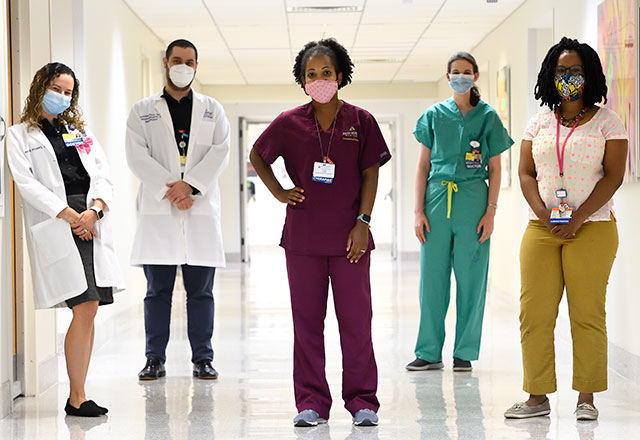 a group of masked clinicians