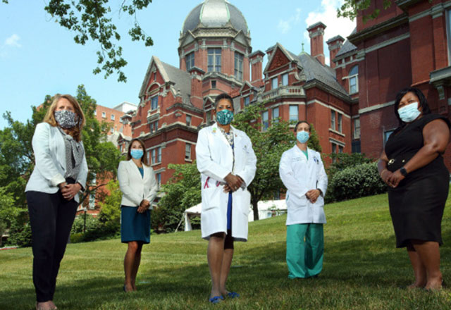 members of the pandemic anchor workgroup stand outside the Dome