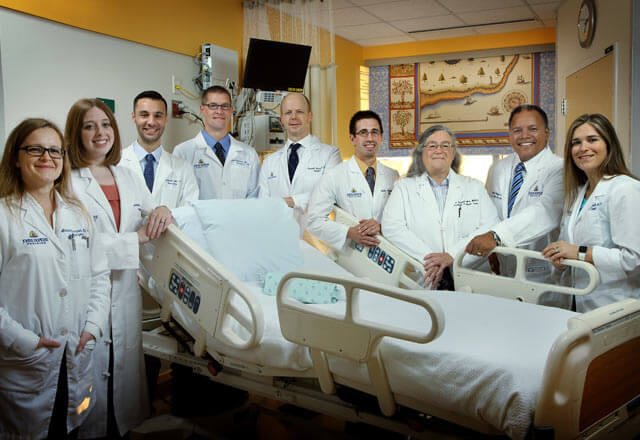 department posing by a hospital bed