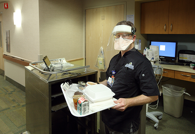 Rob Grader holds tray of food