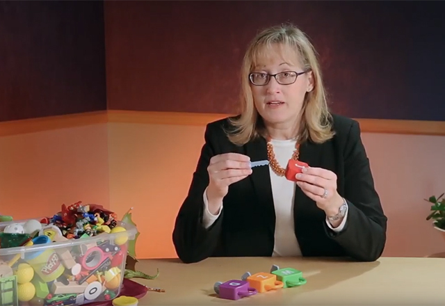 doctor showing science using figurines