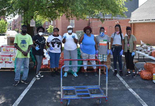 South Baltimore Partnership volunteers prepare to distribute fresh meat and produce to neighbors during the COVID-19 pandemic