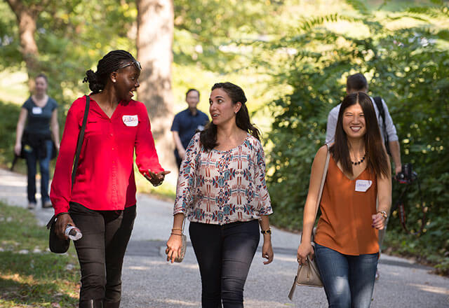 students walking and talking on campus