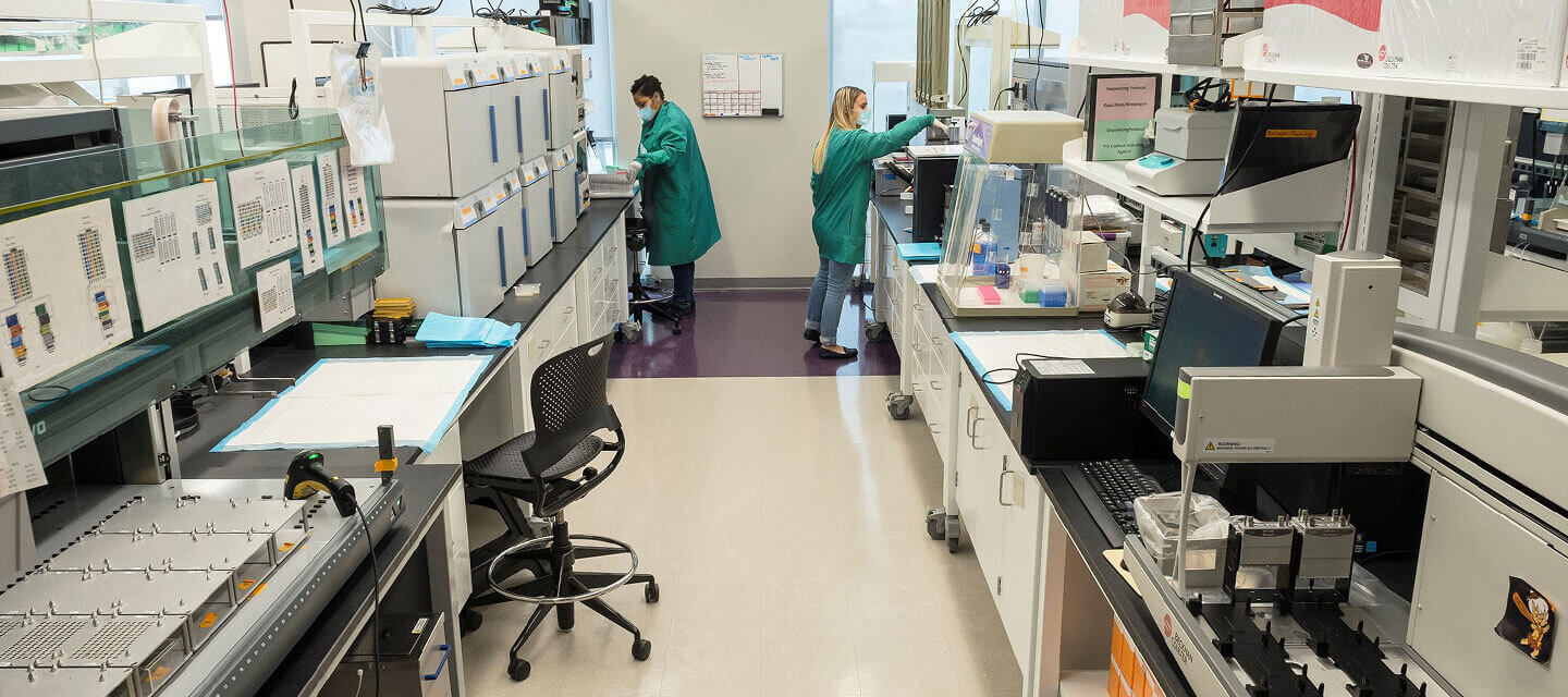 Two women work in a lab.