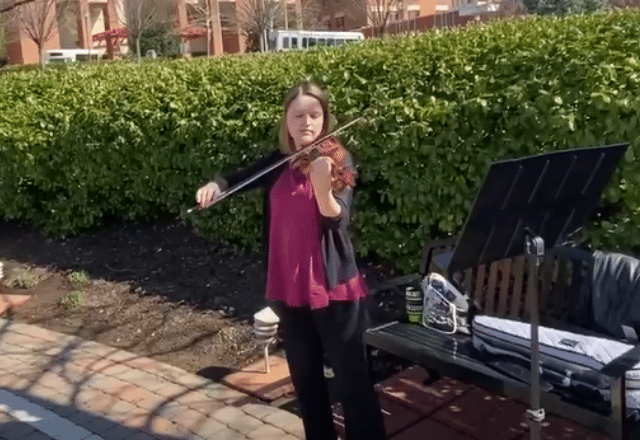 violist playing outside