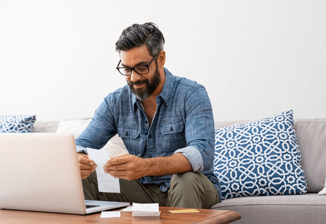 man looking at laptop