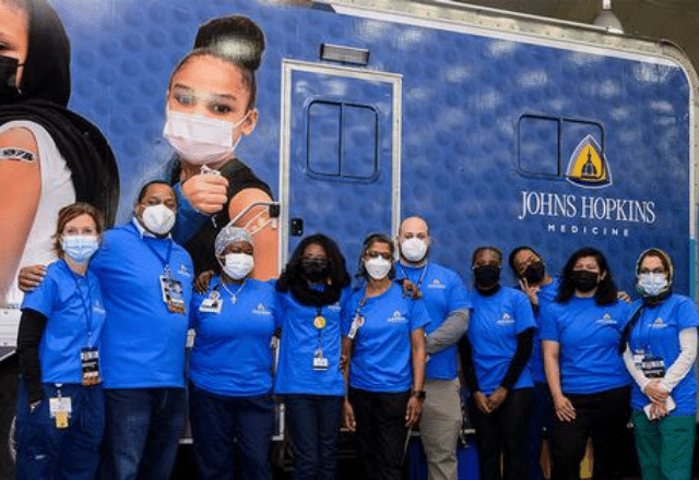 The Johns Hopkins Mobile Vaccine Team poses for a photo.