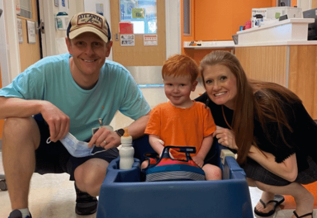 Braxton Davis, shown with his parents, Beth and Brent