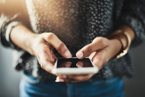 woman's hand holding a phone